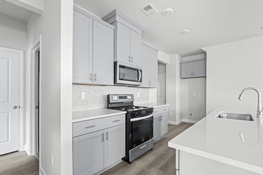 Furnished interior view inside a new home in Waterside - Boardwalk Series, Longs (Image 5).