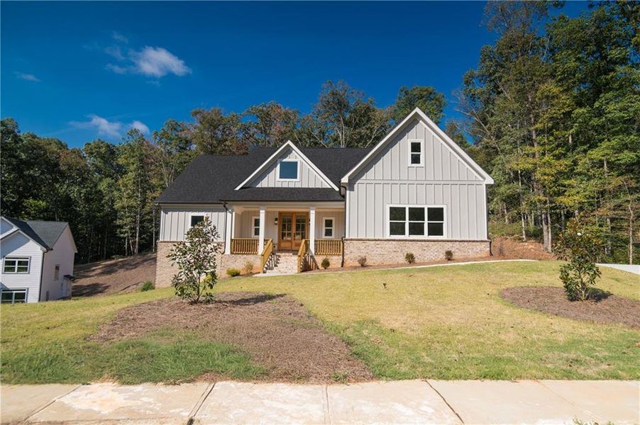 Front exterior of a new home in , Clermont, GA, highlighting curb appeal (Image 25).
