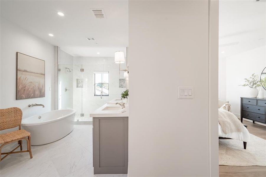 Bathroom with vanity and plus walk in shower