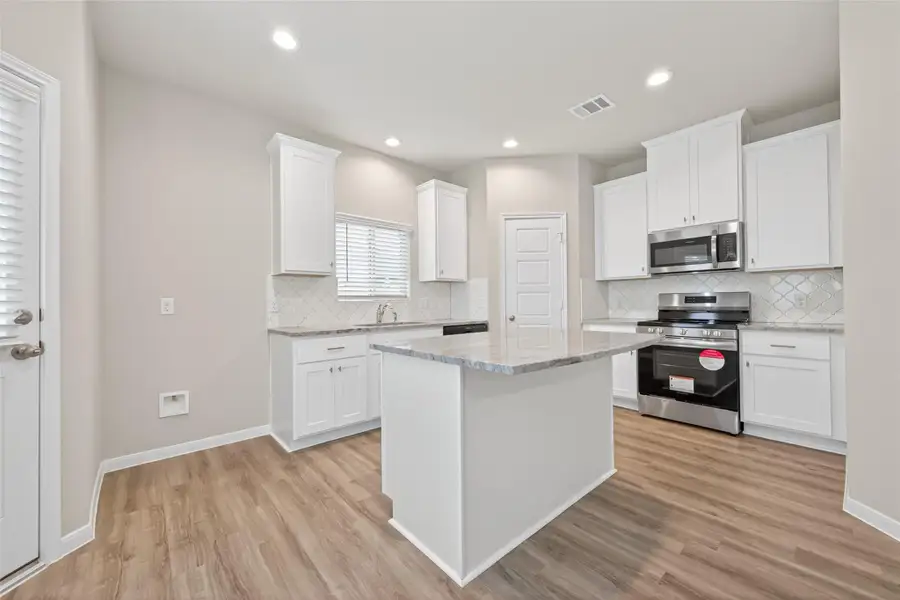Furnished interior view inside a new home in Woodland Lakes, Houston (Image 5).