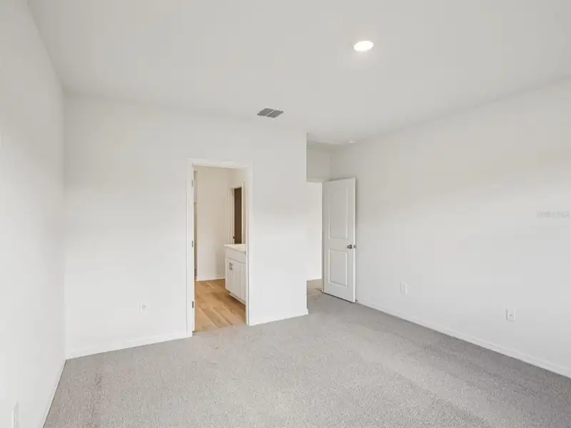 Spacious, unfurnished interior of a new home in The Reserve at Van Oaks, Auburndale (Image 14).