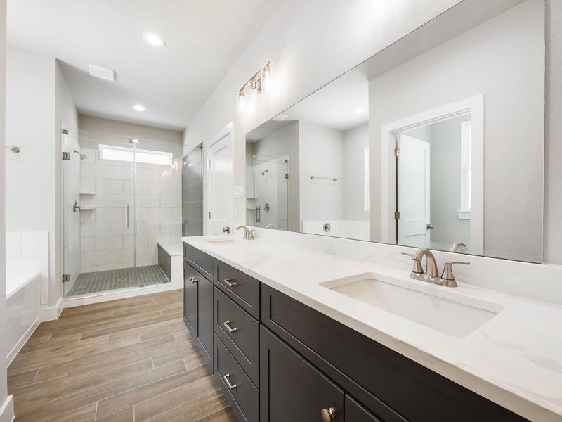 Bathroom is mix of navy blue and white cabinets Bathroom is mix of navy blue and white cabinets