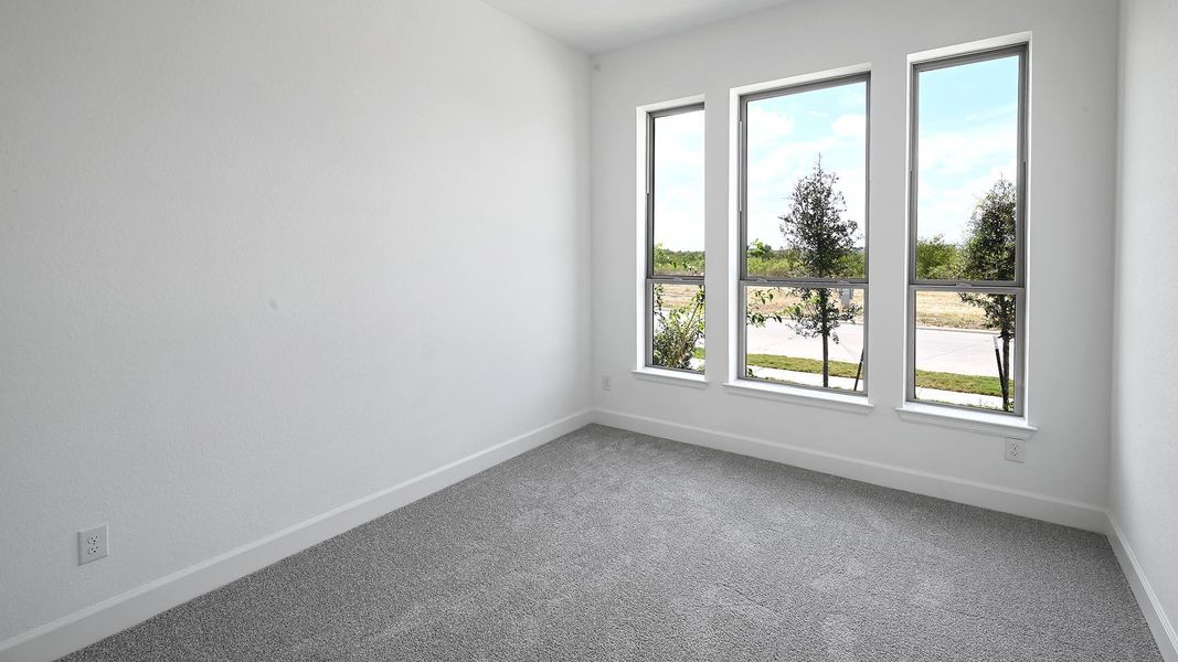 Unfurnished room featuring carpet flooring and baseboards Unfurnished room featuring carpet flooring and baseboards