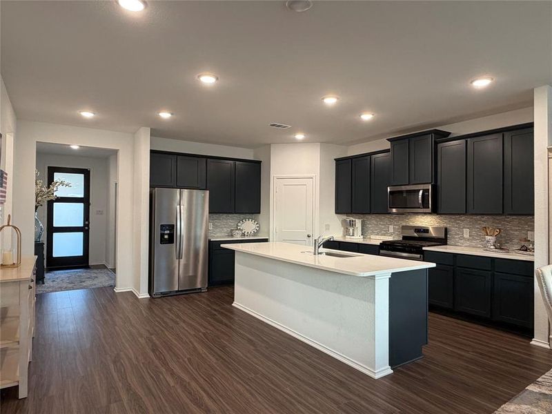 You’ll Love Gathering in the Kitchen, Which Centers Around a Massive Frost White Quartz Island with Breakfast Bar