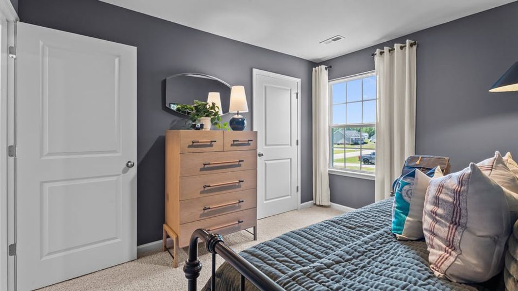 Furnished interior in a model home at Bynum Farms in Farmville (Image 15). Furnished interior in a model home at Bynum Farms in Farmville (Image 15).