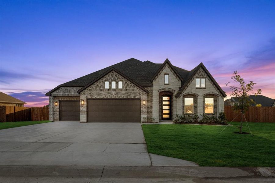 Front exterior of a new home in Coyote Crossing, Godley, TX, highlighting curb appeal (Image 22). Front exterior of a new home in Coyote Crossing, Godley, TX, highlighting curb appeal (Image 22).