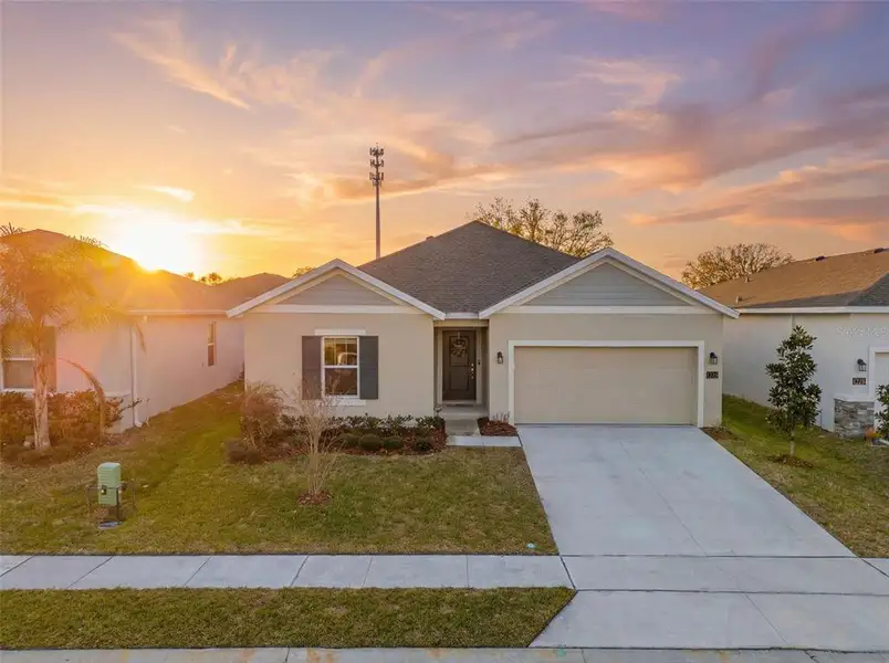 Front exterior of a new home in Vineland Reserve, Osteen, FL, highlighting curb appeal (Image 25).