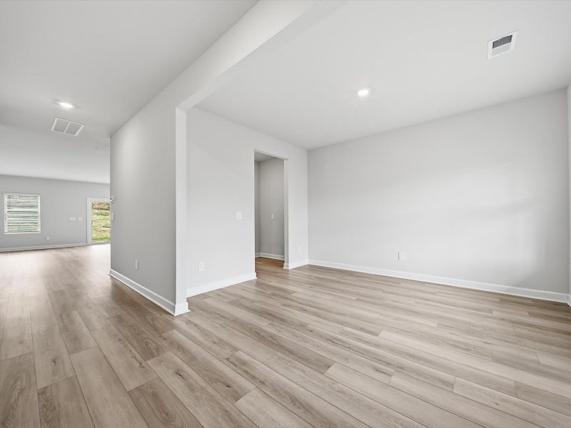 Spacious, unfurnished interior of a new home in The Farm at Wells Creek - Signature Collection, Gray Court (Image 10).