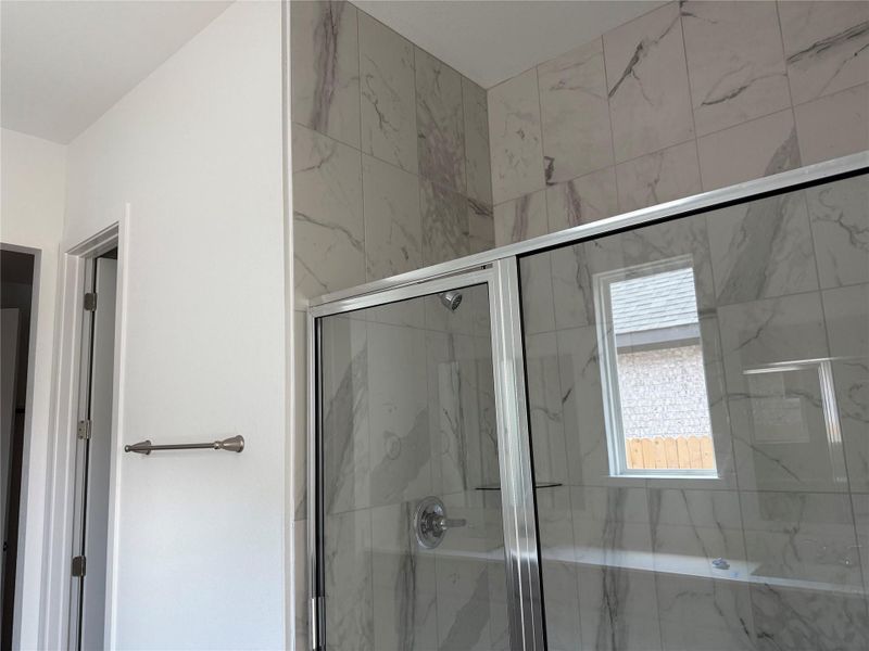 Full bathroom featuring a marble finish shower Full bathroom featuring a marble finish shower