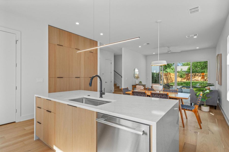 The center island and adjacent built in pantry provides plenty of storage options. The center island and adjacent built in pantry provides plenty of storage options.