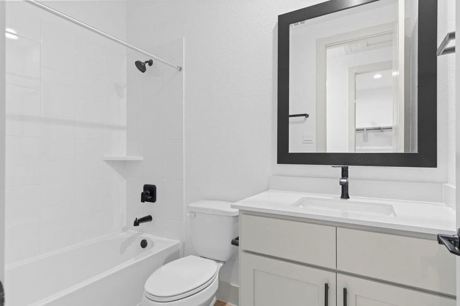 A well-designed bathroom equipped with quartz countertops, a standing tub, and a single vanity. A well-designed bathroom equipped with quartz countertops, a standing tub, and a single vanity.