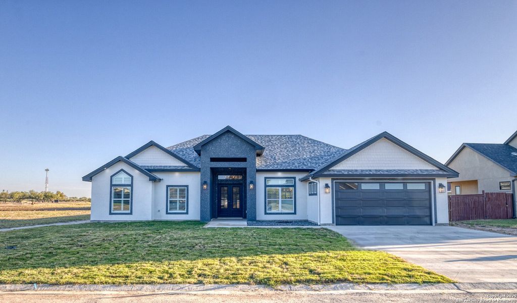 Front exterior of a new home in , Uvalde, TX, highlighting curb appeal (Image 22).