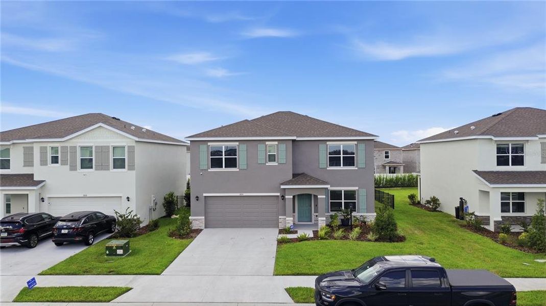 Front exterior of a new home in Star Farms at Lakewood Ranch, Lakewood Ranch, FL, highlighting curb appeal (Image 1). Front exterior of a new home in Star Farms at Lakewood Ranch, Lakewood Ranch, FL, highlighting curb appeal (Image 1).