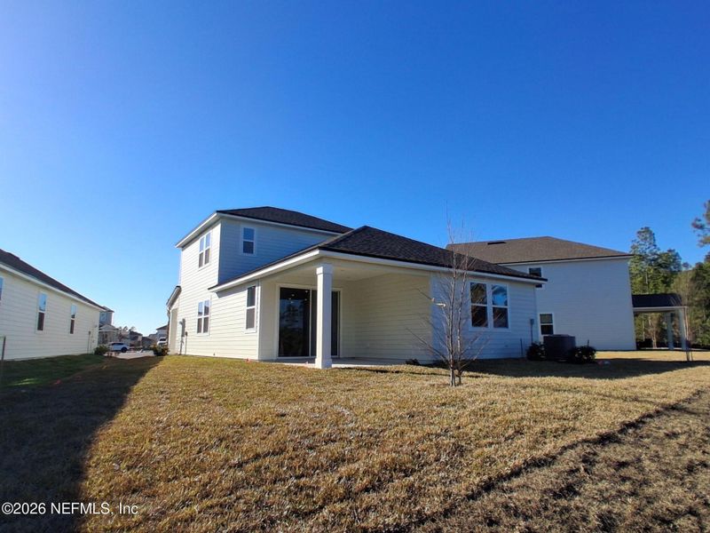 Exterior details and patio area of a home in Seminole Palms, Palm Coast (Image 4).
