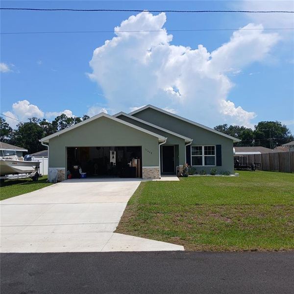 Front exterior of a new home in , Dunnellon, FL, highlighting curb appeal (Image 22).