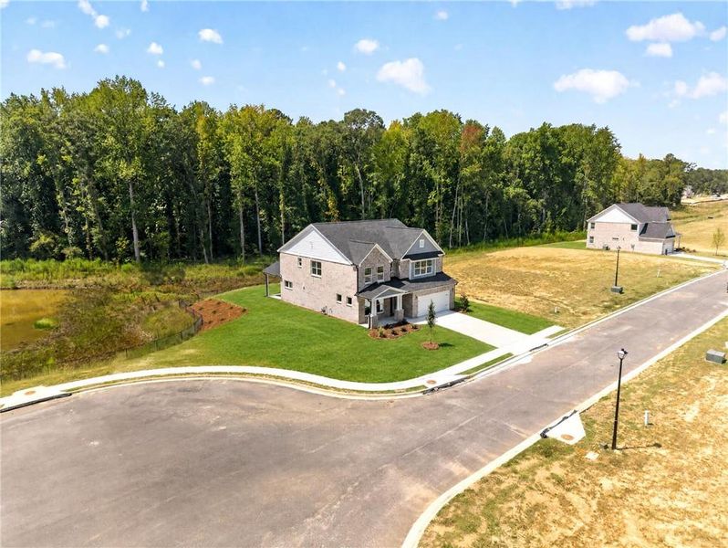 Front exterior of a new home in , Loganville, GA, highlighting curb appeal (Image 27). Front exterior of a new home in , Loganville, GA, highlighting curb appeal (Image 27).