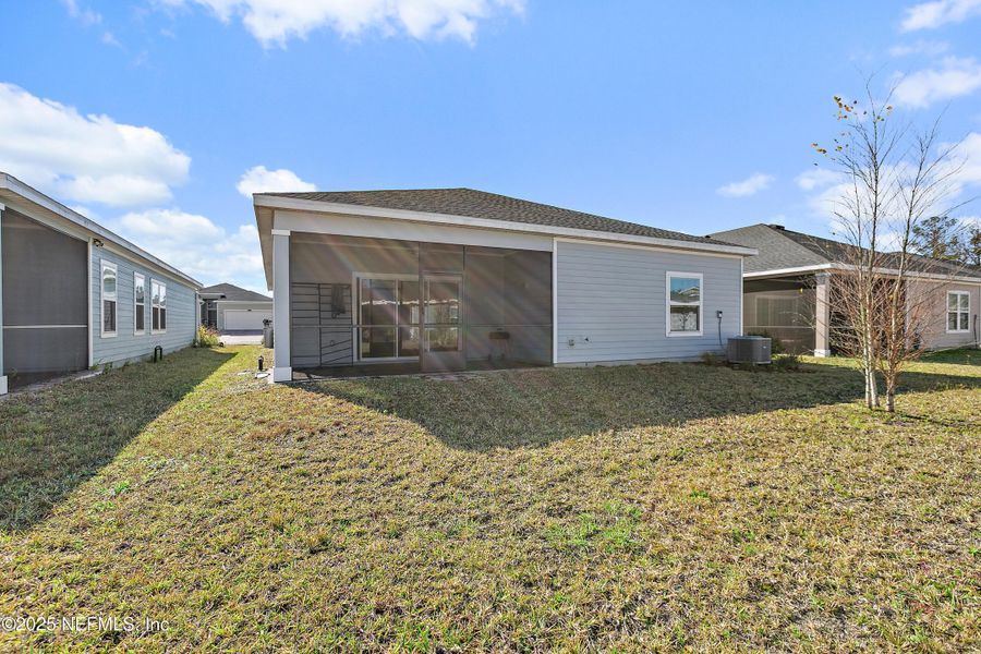 Exterior details and patio area of a home in Gentle Woods North, Jacksonville (Image 3).