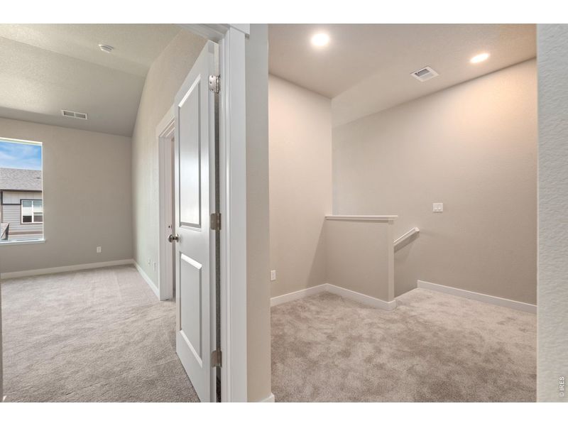 Spacious, unfurnished interior of a new home in The Lakes at Centerra - Discovery, Loveland (Image 10).