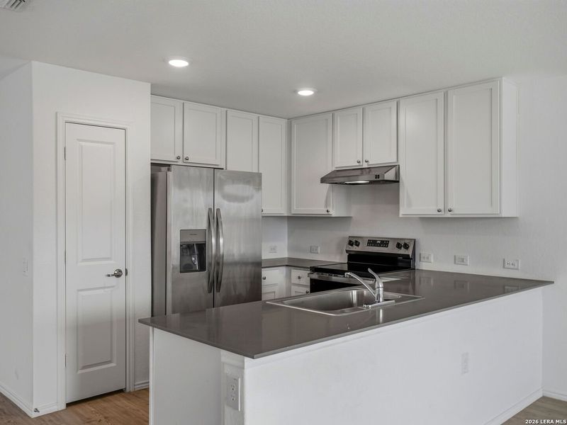 Furnished interior view inside a new home in Mission del Lago, San Antonio (Image 7).