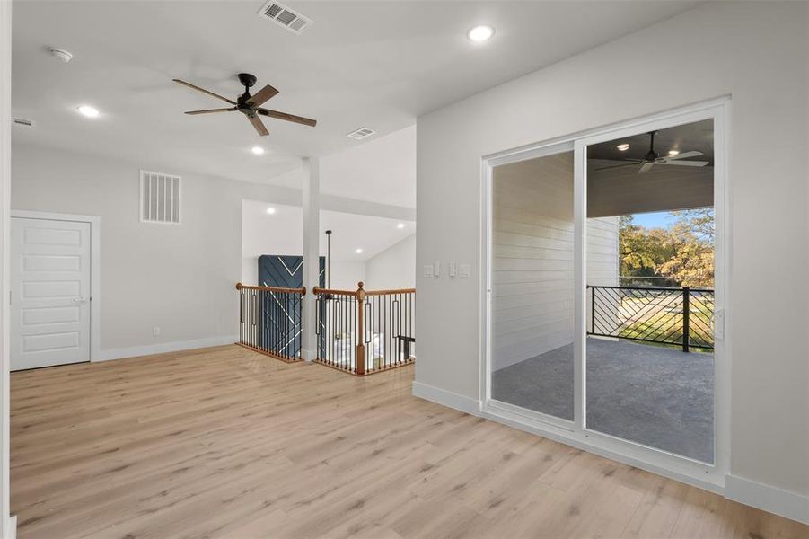 Unfurnished room featuring ceiling fan and light hardwood / wood-style flooring