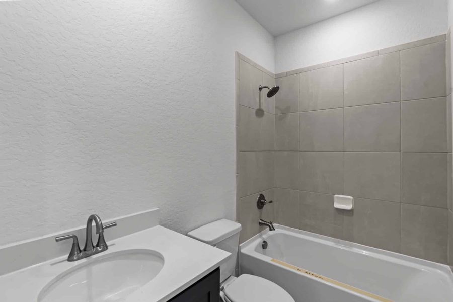 Furnished interior view inside a new home in Centero at Stone Oak, San Antonio (Image 11).