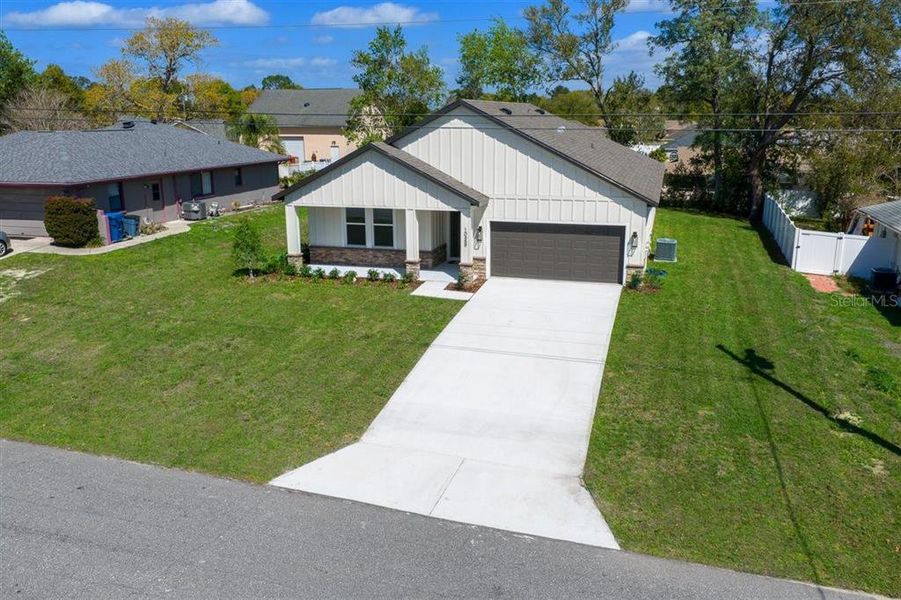 Front exterior of a new home in , Spring Hill, FL, highlighting curb appeal (Image 26). Front exterior of a new home in , Spring Hill, FL, highlighting curb appeal (Image 26).