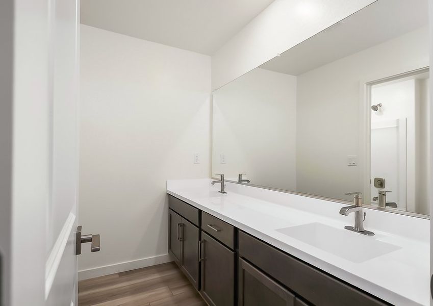 Secondary bathroom double vanity with cultured marble countertop in Wellton floor plan