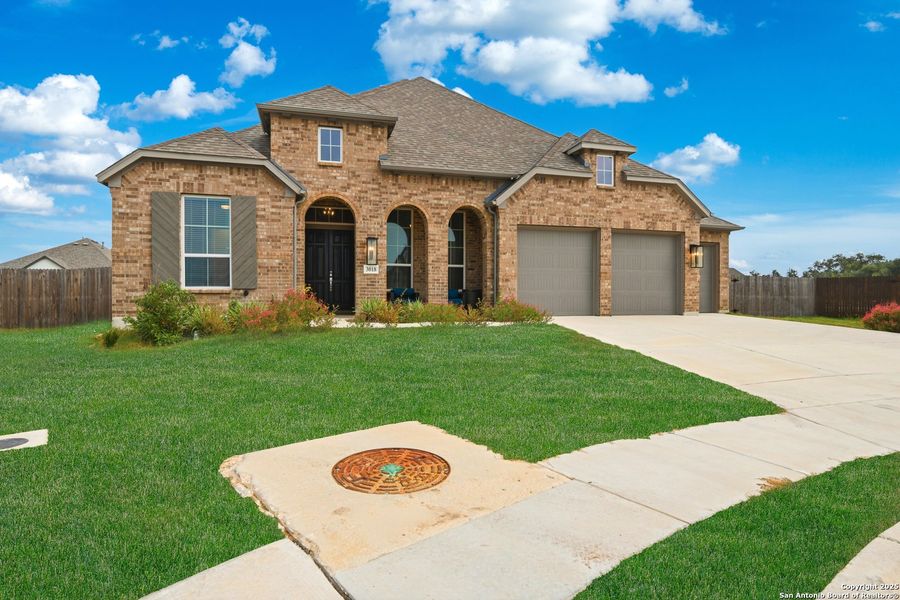 Front exterior of a new home in , Bulverde, TX, highlighting curb appeal (Image 24). Front exterior of a new home in , Bulverde, TX, highlighting curb appeal (Image 24).