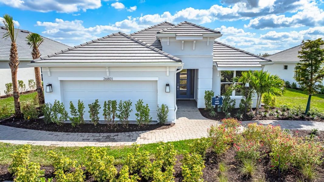 Representative exterior photo of a completed home built from the Lazio by Taylor Morrison in Esplanade at Starling, Punta Gorda, FL (Image 1). Representative exterior photo of a completed home built from the Lazio by Taylor Morrison in Esplanade at Starling, Punta Gorda, FL (Image 1).