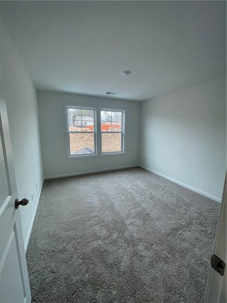 Spacious, unfurnished interior of a new home in Springwood Grove, Central (Image 24).