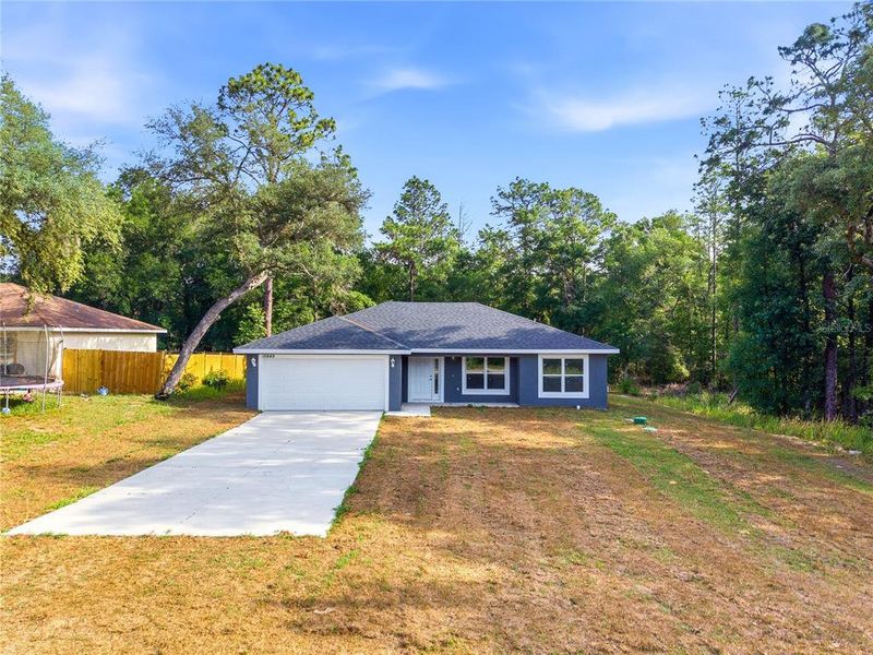 Front exterior of a new home in , Ocala, FL, highlighting curb appeal (Image 18). Front exterior of a new home in , Ocala, FL, highlighting curb appeal (Image 18).
