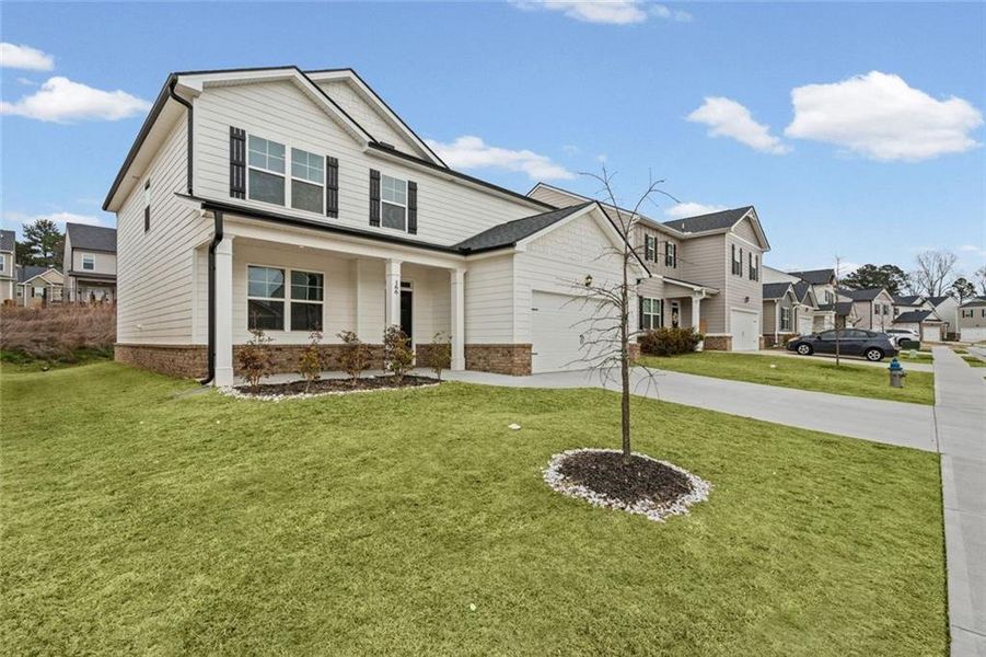 Front exterior of a new home in Twin Lakes, Hoschton, GA, highlighting curb appeal (Image 26).