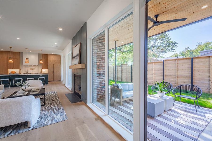 Living room with light wood-type flooring and ceiling fan