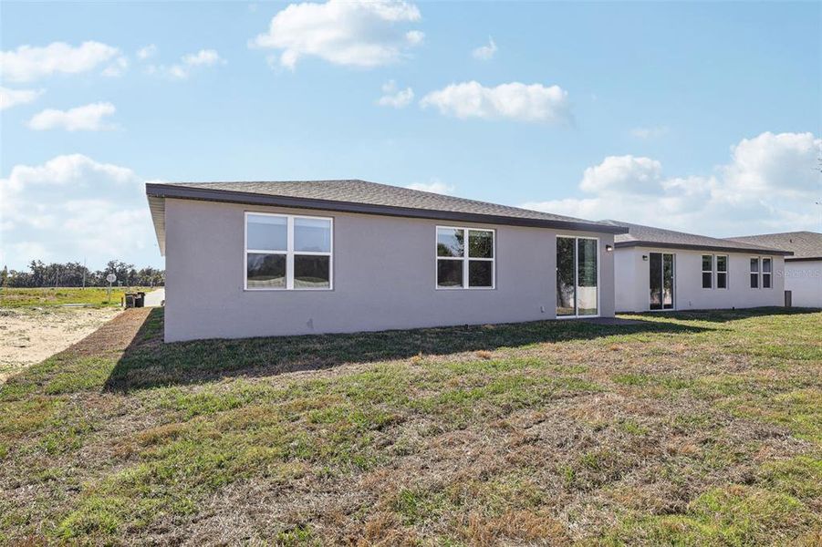 Exterior details and patio area of a home in Bradbury Creek - Signature Series, Haines City (Image 4).