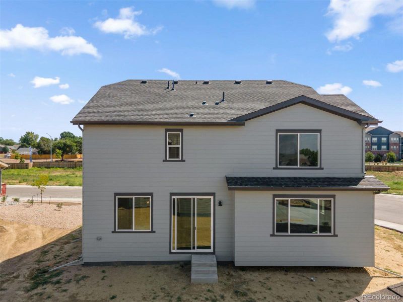 Front exterior of a new home in Cherry Meadows, Brighton, CO, highlighting curb appeal (Image 20). Front exterior of a new home in Cherry Meadows, Brighton, CO, highlighting curb appeal (Image 20).