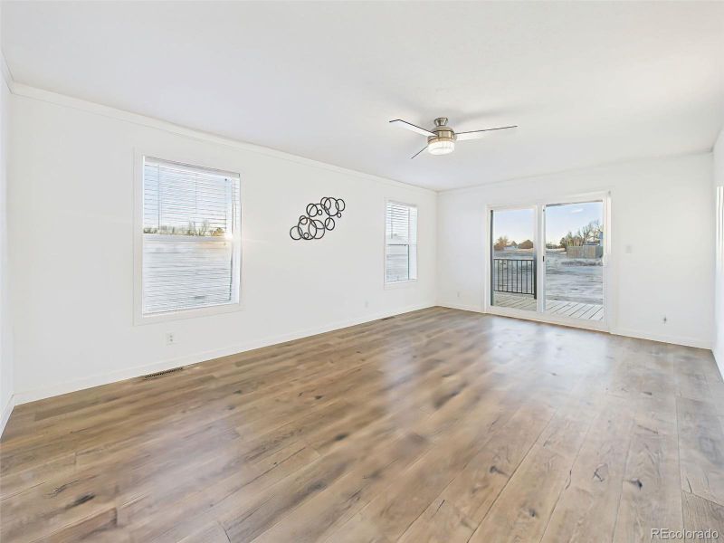 Living Room Clean lines and expansive floors define this versatile living space, offering ample room for various furniture layouts and direct outdoor access.
