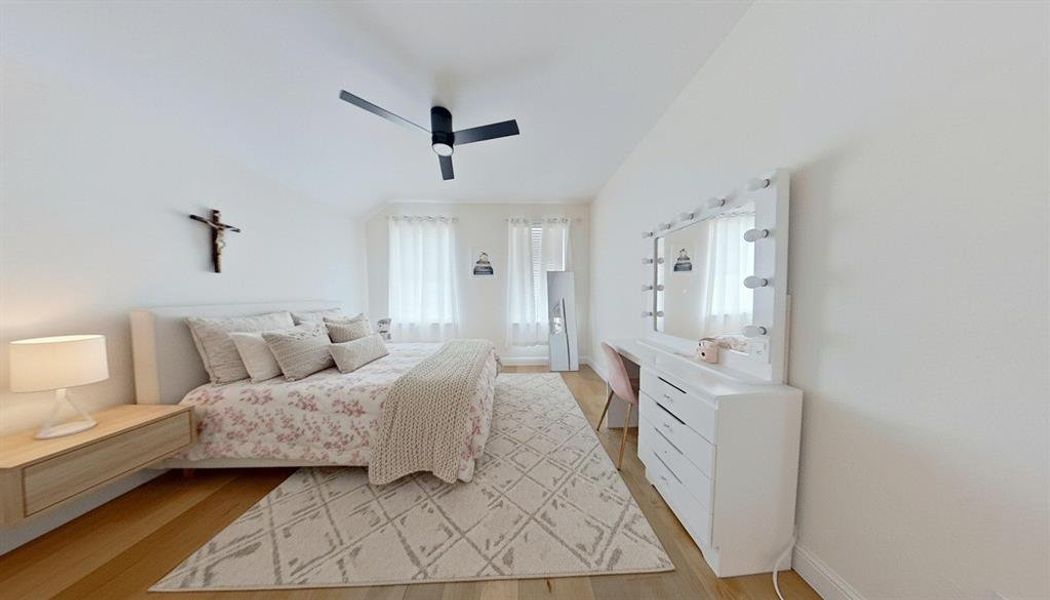 Bedroom with light wood-type flooring and ceiling fan