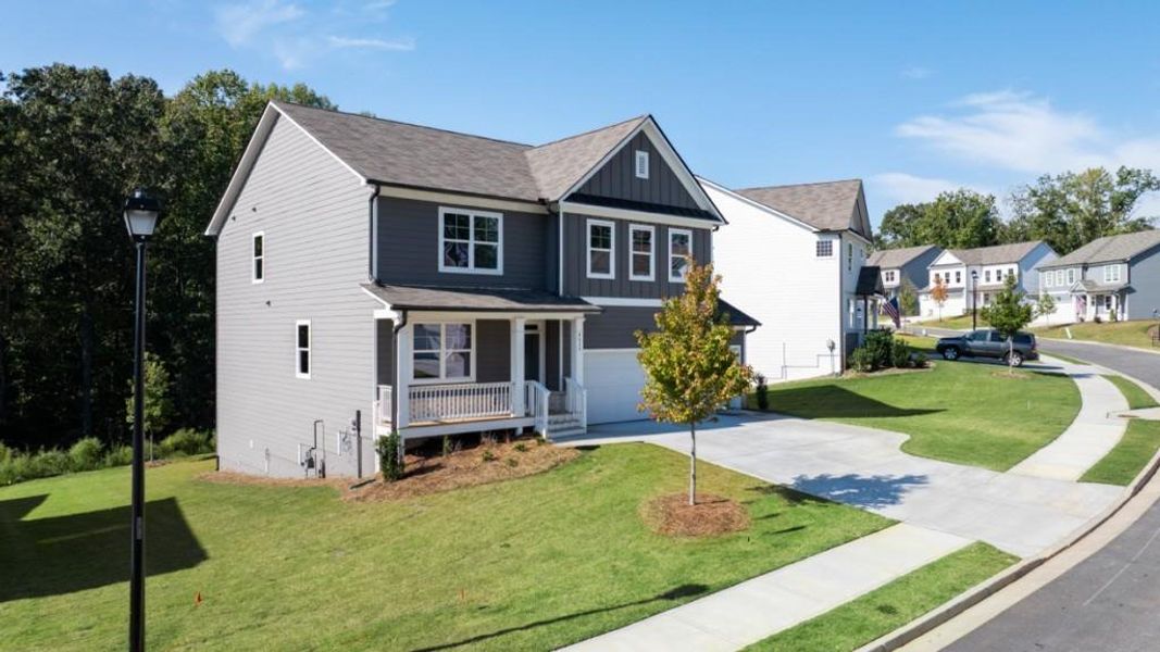 Front exterior of a new home in Falcon Landing, Gainesville, GA, highlighting curb appeal (Image 16).
