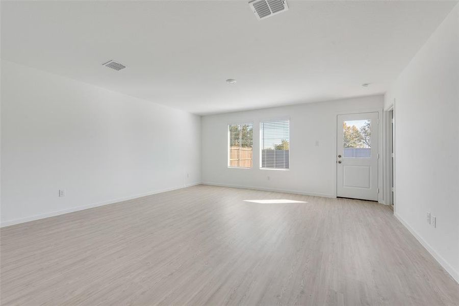 Spare room with light wood-type flooring