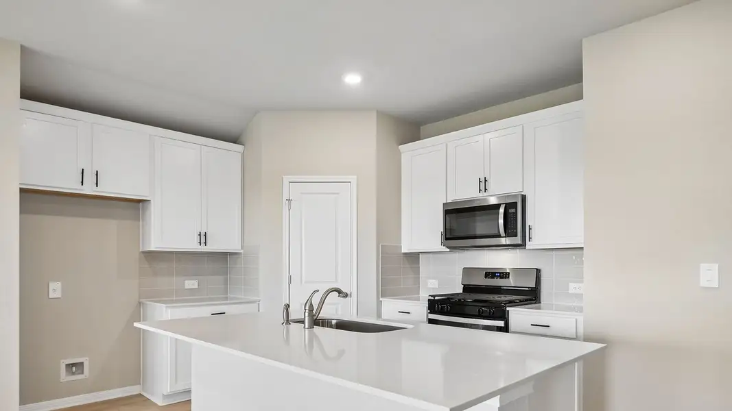 Furnished interior view inside a new home in Carillon, Manor (Image 7).