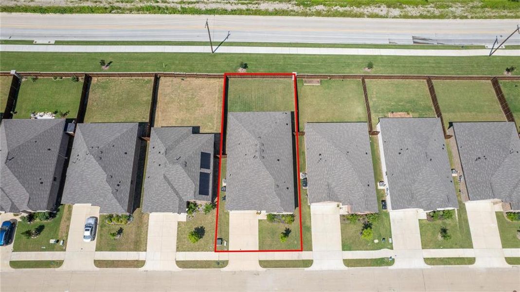 Aerial perspective of suburban area featuring property boundaries highlighted
