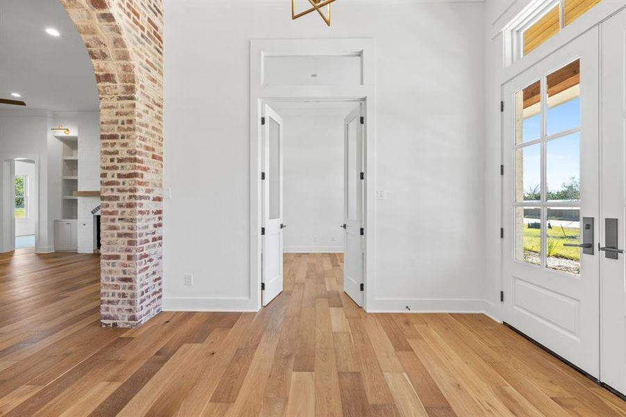 Foyer entrance featuring light hardwood / wood-style flooring and a healthy amount of sunlight