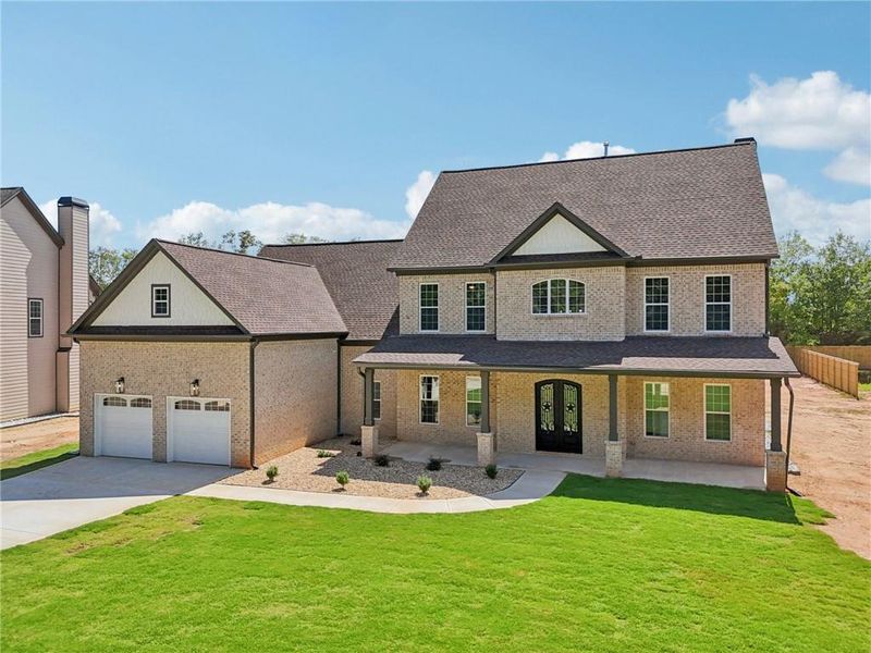Front exterior of a new home in , Lilburn, GA, highlighting curb appeal (Image 32).