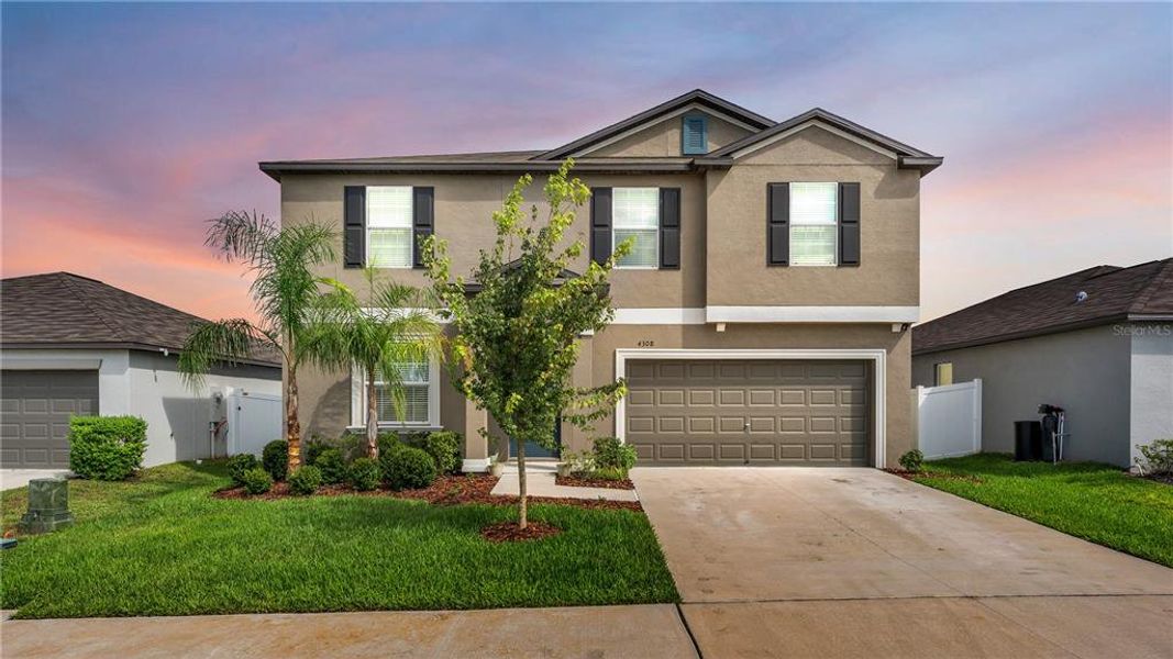Front exterior of a new home in Wind Meadows South, Bartow, FL, highlighting curb appeal (Image 27).