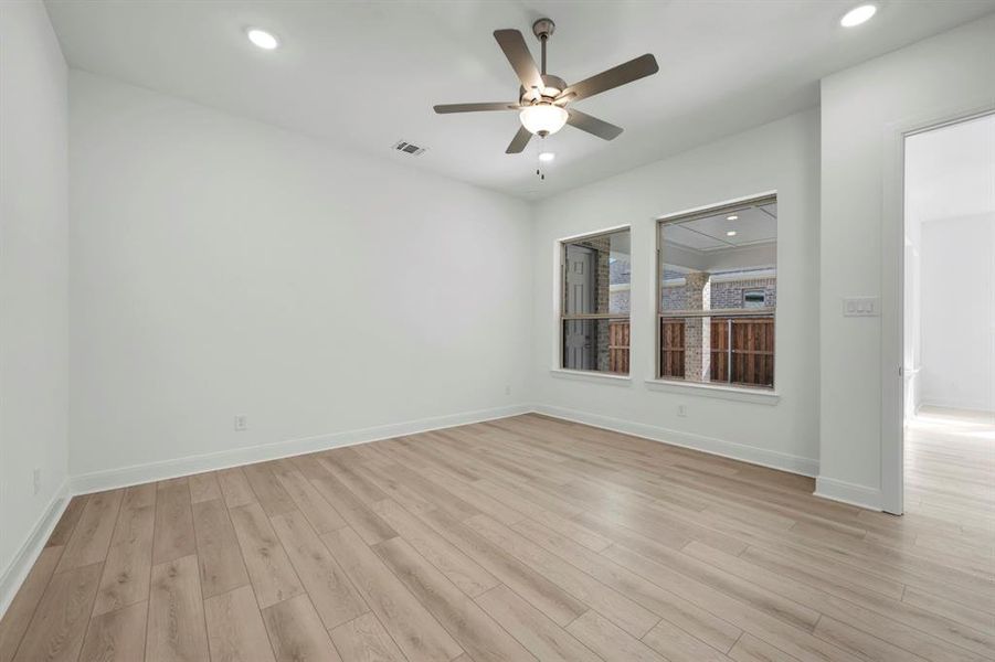 Unfurnished room with a ceiling fan, recessed lighting, and light wood-style flooring Unfurnished room with a ceiling fan, recessed lighting, and light wood-style flooring