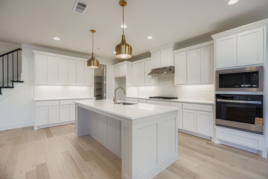 Furnished interior view inside a new home in Castle Hills Northpointe - Townhomes, Carrollton (Image 8). Furnished interior view inside a new home in Castle Hills Northpointe - Townhomes, Carrollton (Image 8).