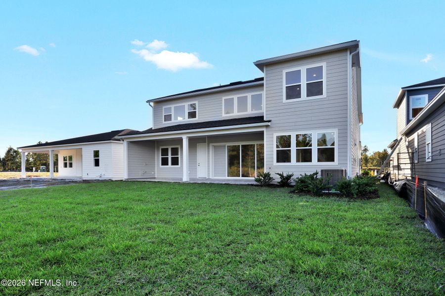 Exterior details and patio area of a home in The Landings at Saint Johns, St. Johns (Image 29).