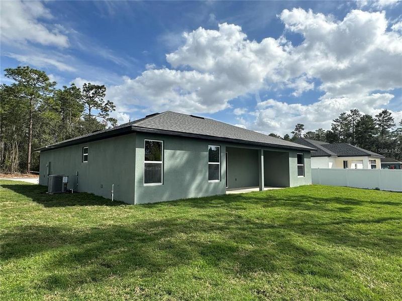 Exterior details and patio area of a home in Marion Oaks, Ocala (Image 19).