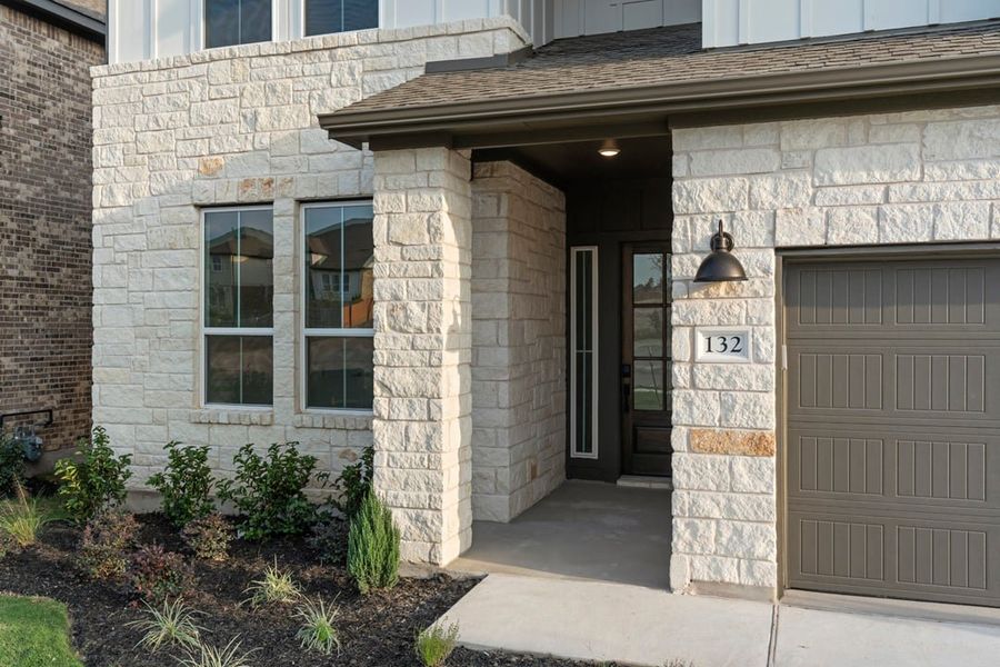 Exterior details and patio area of a home in Park Collection at Lariat, Liberty Hill (Image 3). Exterior details and patio area of a home in Park Collection at Lariat, Liberty Hill (Image 3).