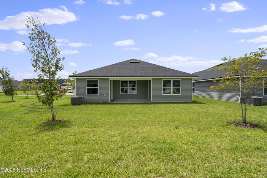 Front exterior of a new home in Summerglen, Jacksonville, FL, highlighting curb appeal (Image 15). Front exterior of a new home in Summerglen, Jacksonville, FL, highlighting curb appeal (Image 15).